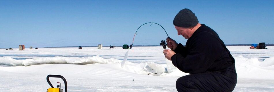 Ice Fishing Adventure on Frozen Lakes in Levi Lapland