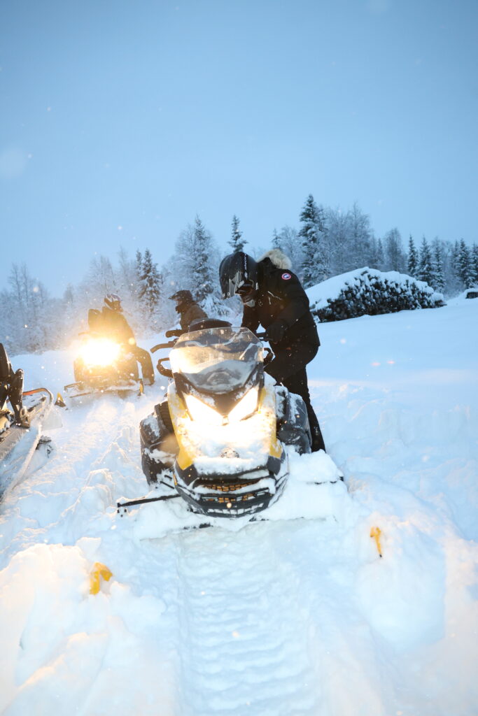 Guests enjoying a snowmobile safari in Levi